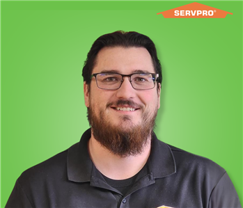 male employee wearing a black SERVPRO shirt