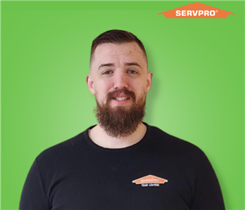 male employee wearing a black SERVPRO shirt