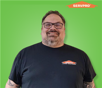 male employee wearing a black SERVPRO shirt