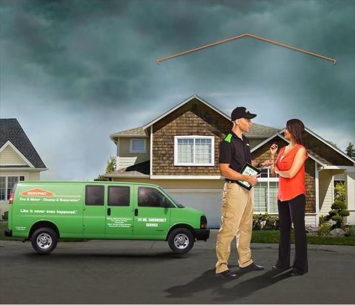 SERVPRO Technician consulting with customer