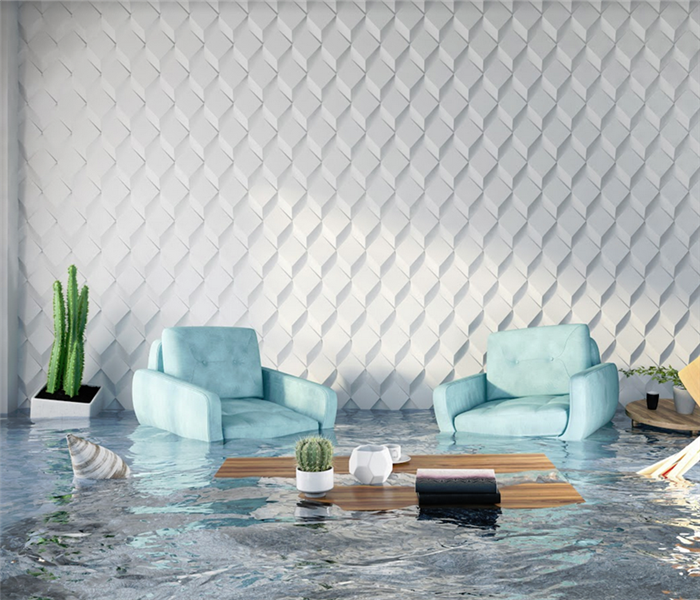 flooded living room with two light blue arm chairs and other furniture floating