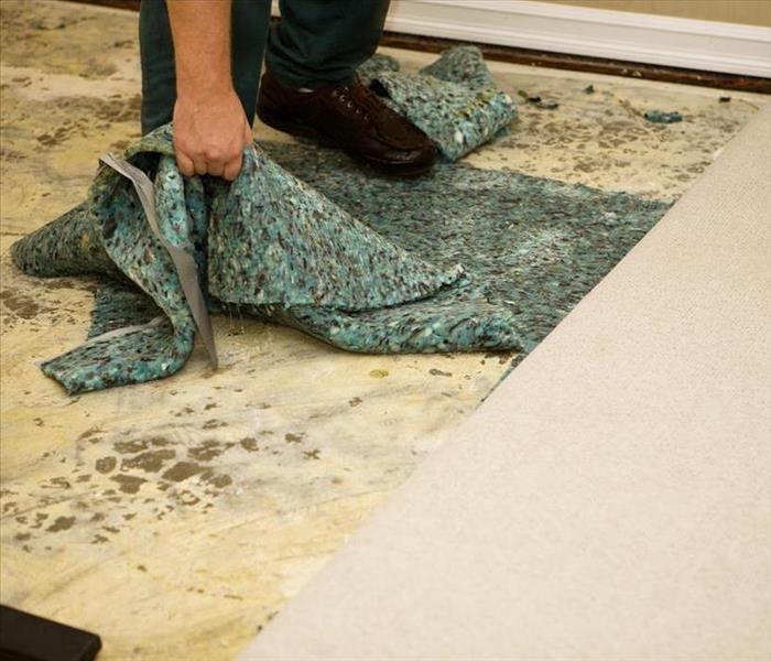 carpet and padding destroyed  by water damage