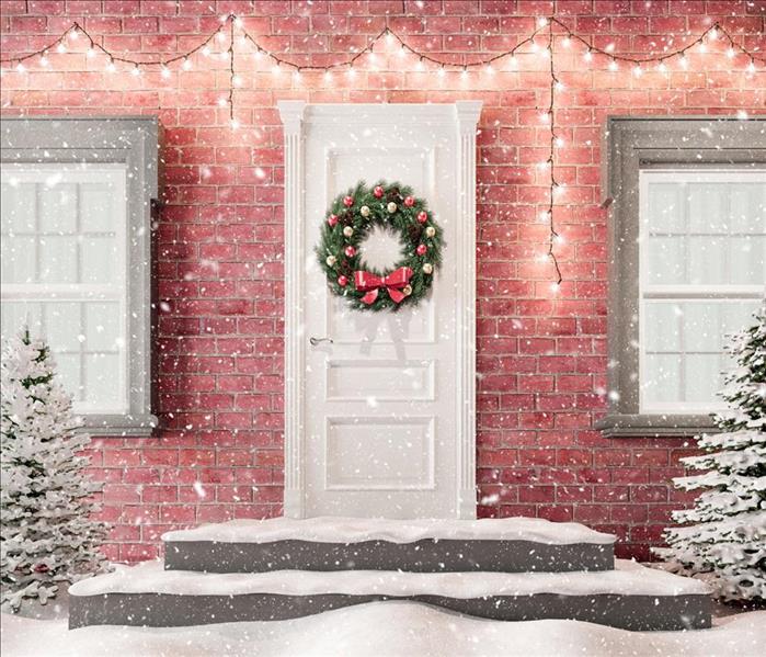 snow, wreath on door, lights on house